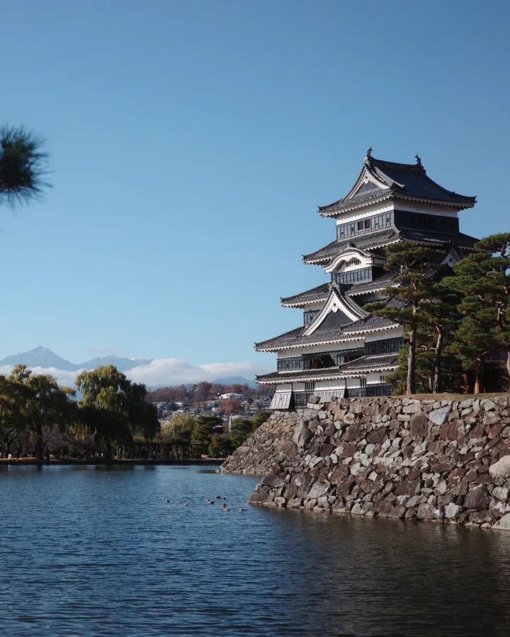 Matsumoto Castle above its moat in afternoon light